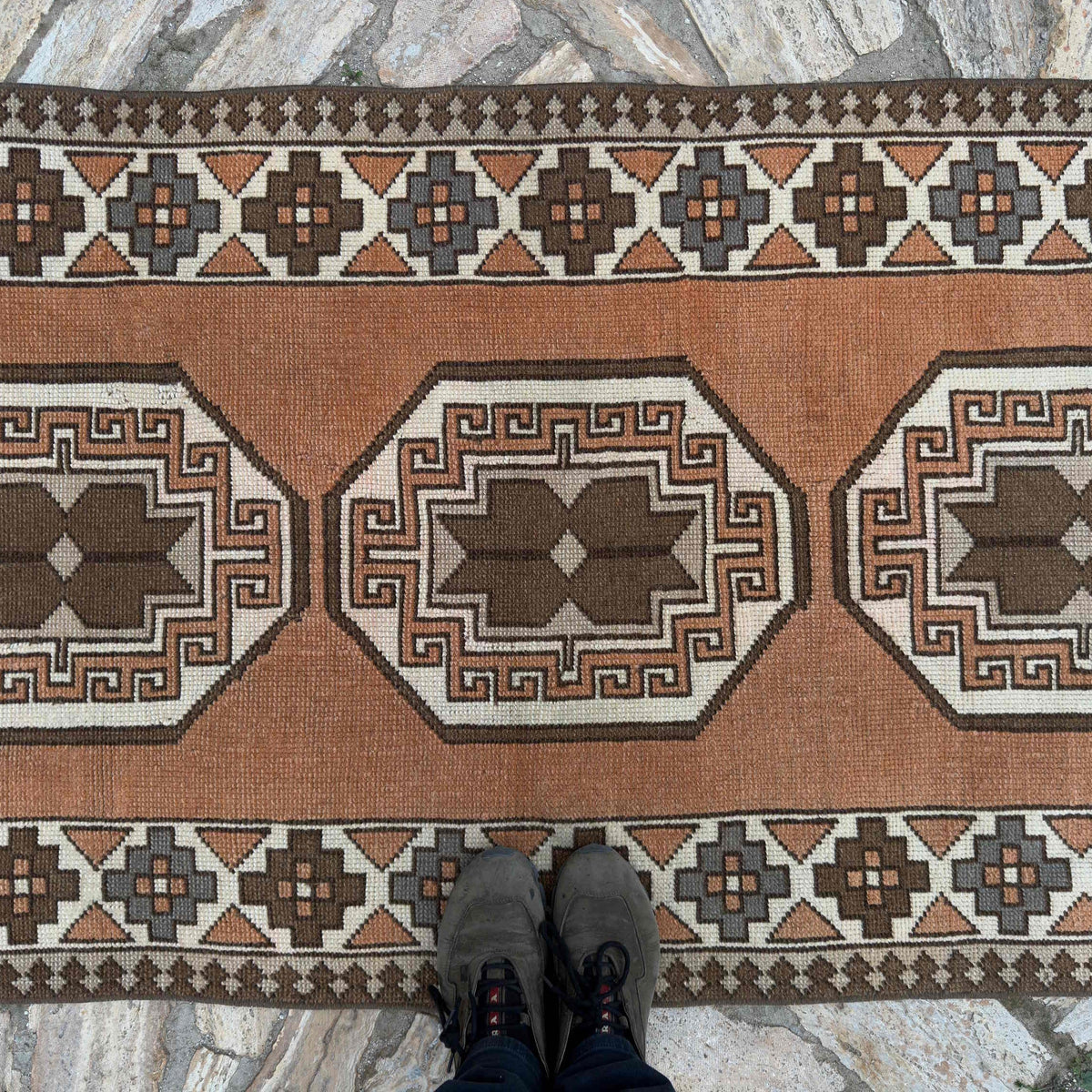 1970s pale orange turkish runner rug with traditional design, hand-knotted weave and low pile.