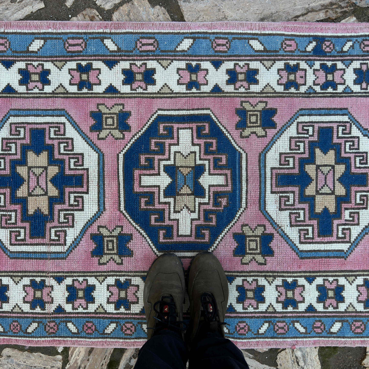 1970s pink turkish runner rug with traditional design, hand-knotted weave and low pile.