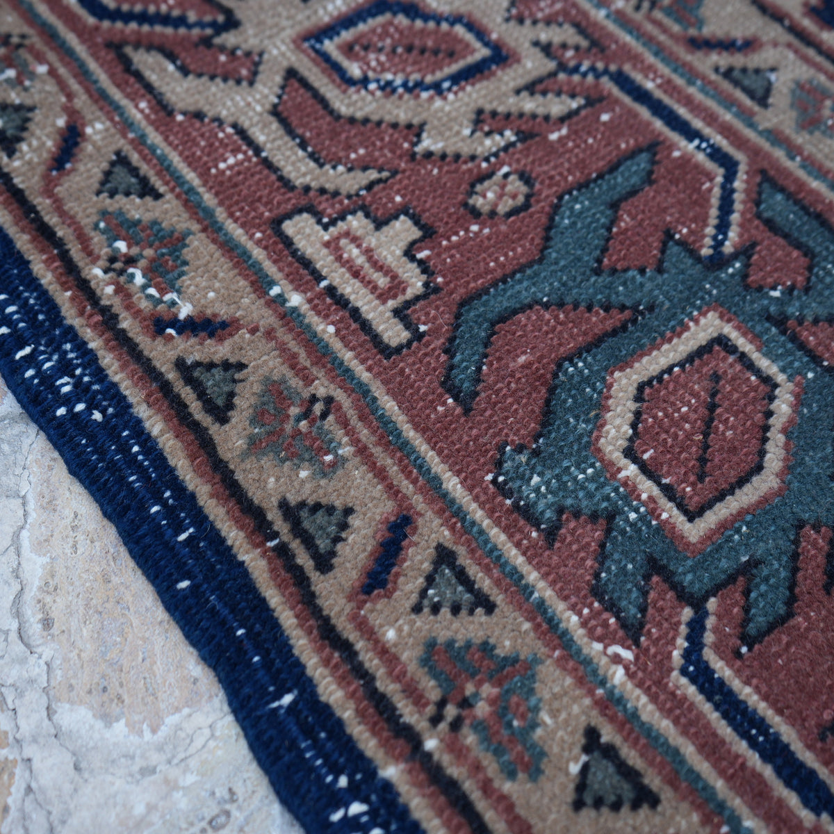 Blue 7' x 9' Turkish unique vintage oushak rug in wool and cotton, shown on the floor.