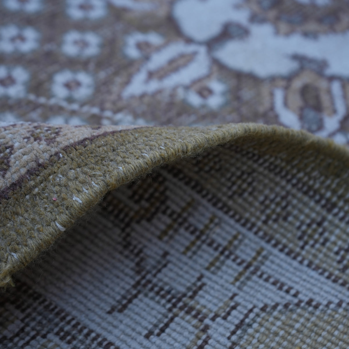 Additional view of the olive green vintage Turkish anatolian rug, hand-knotted in wool and cotton.