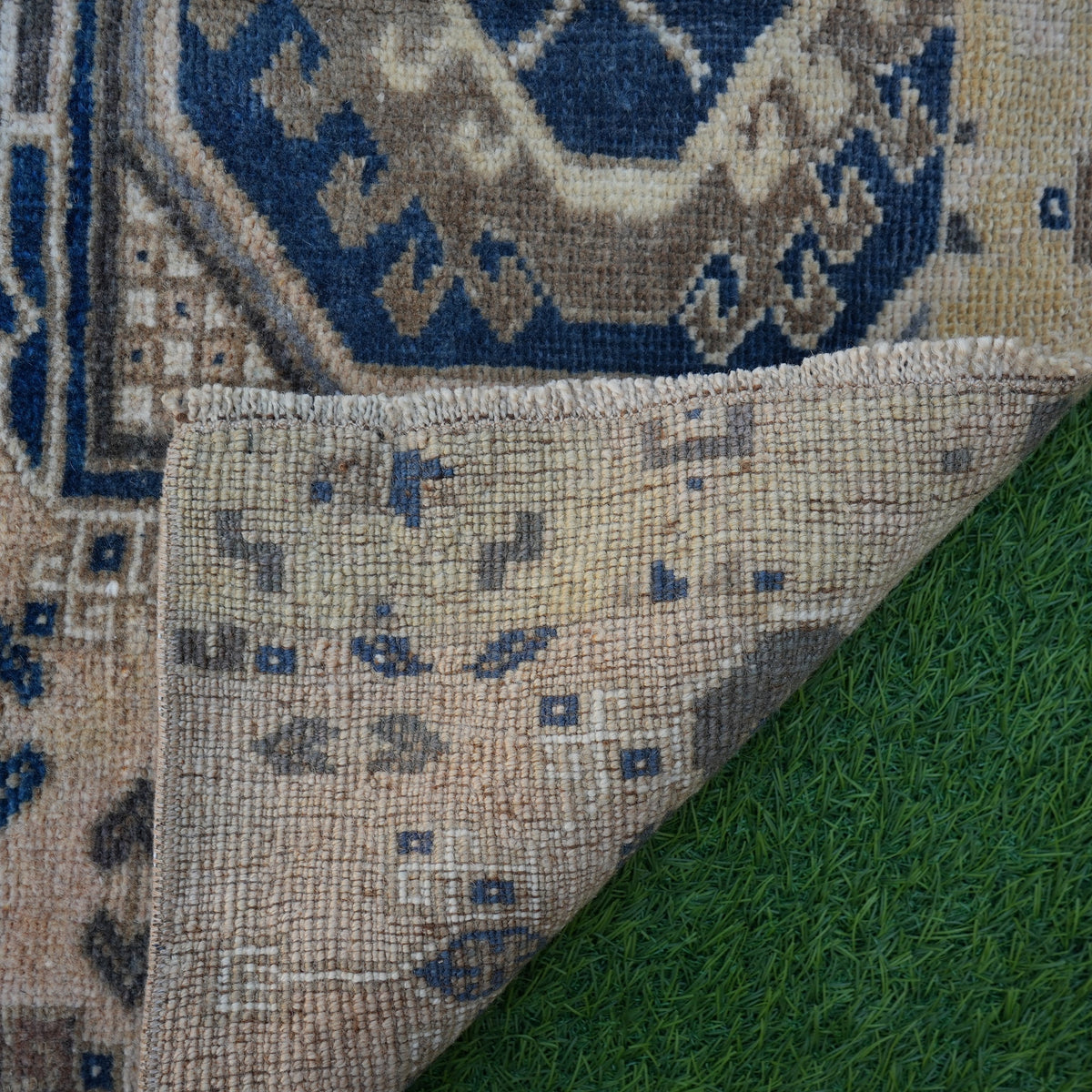 1970s blue vintage Turkish area rug with traditional design, hand-knotted weave and low pile.