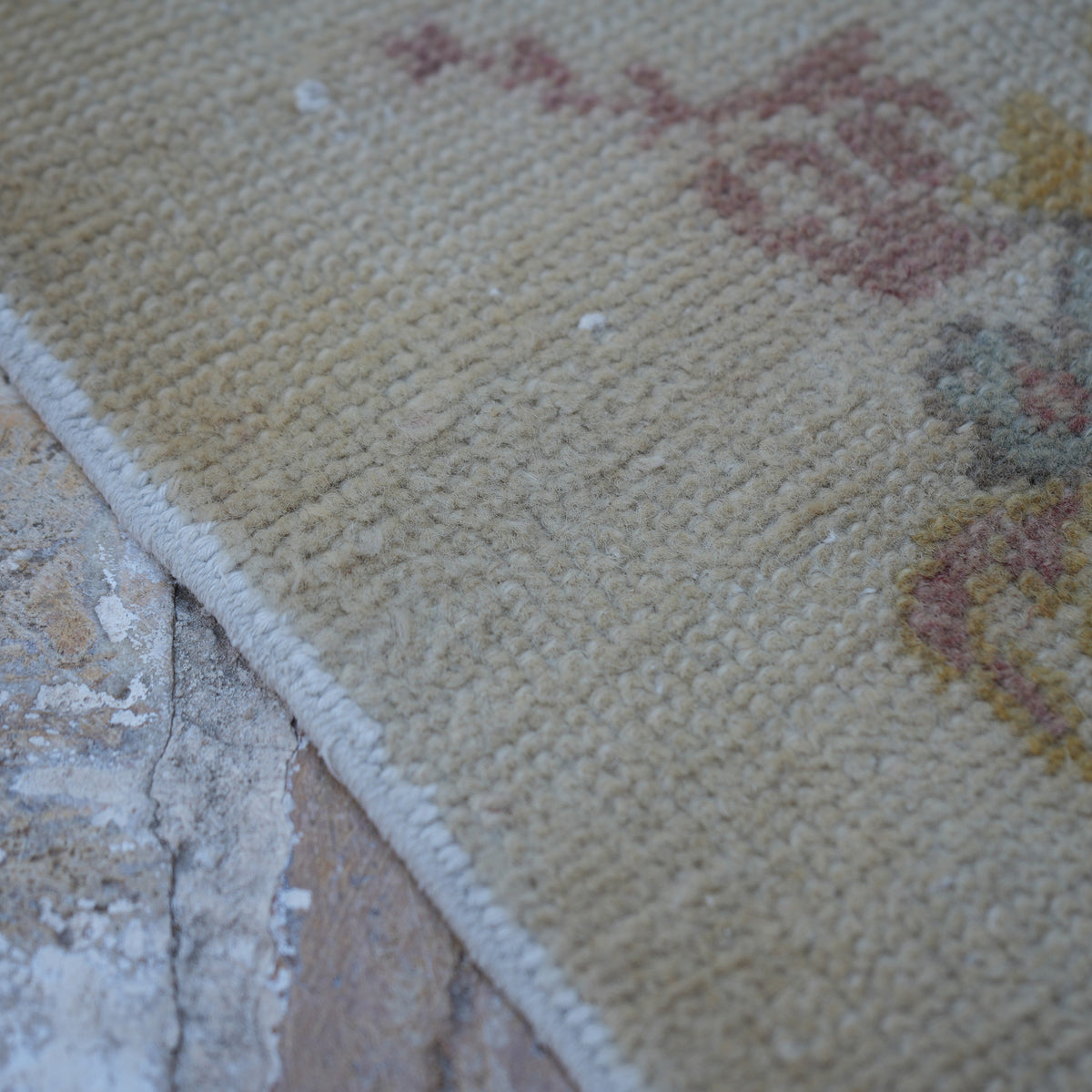 Beige 3' x 6' vintage Turkish area rug in wool and cotton, shown on the floor.