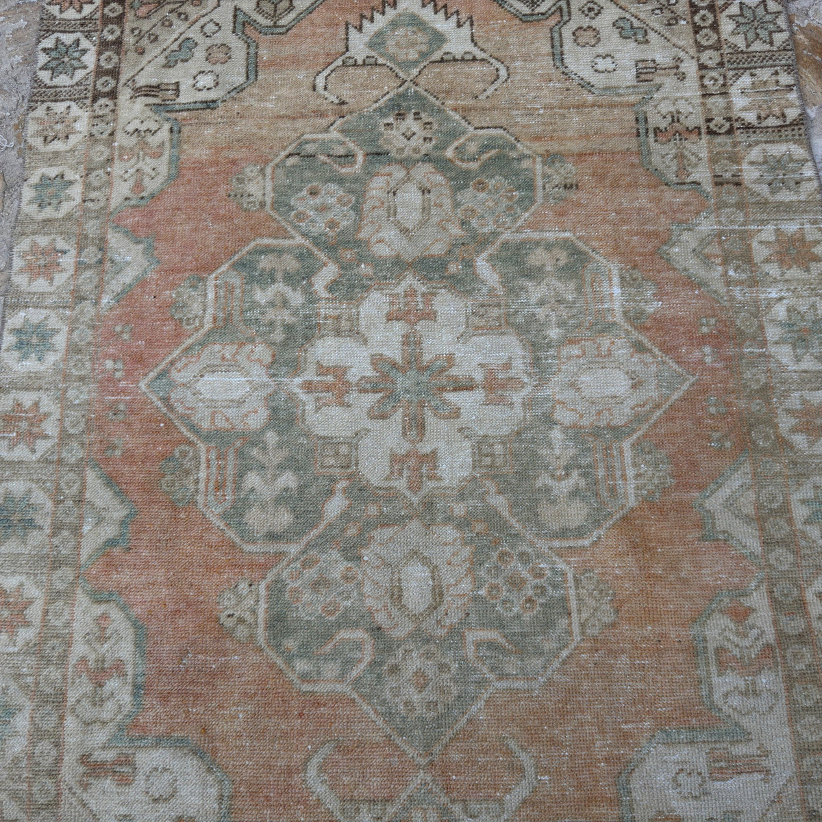 Pale Orange 4' x 6' vintage Turkish area rug in wool and cotton, shown on the floor.