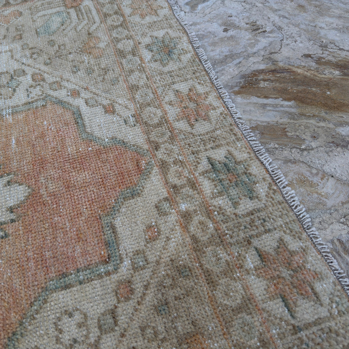 1970s pale orange vintage Turkish area rug with traditional design, hand-knotted weave and low pile.
