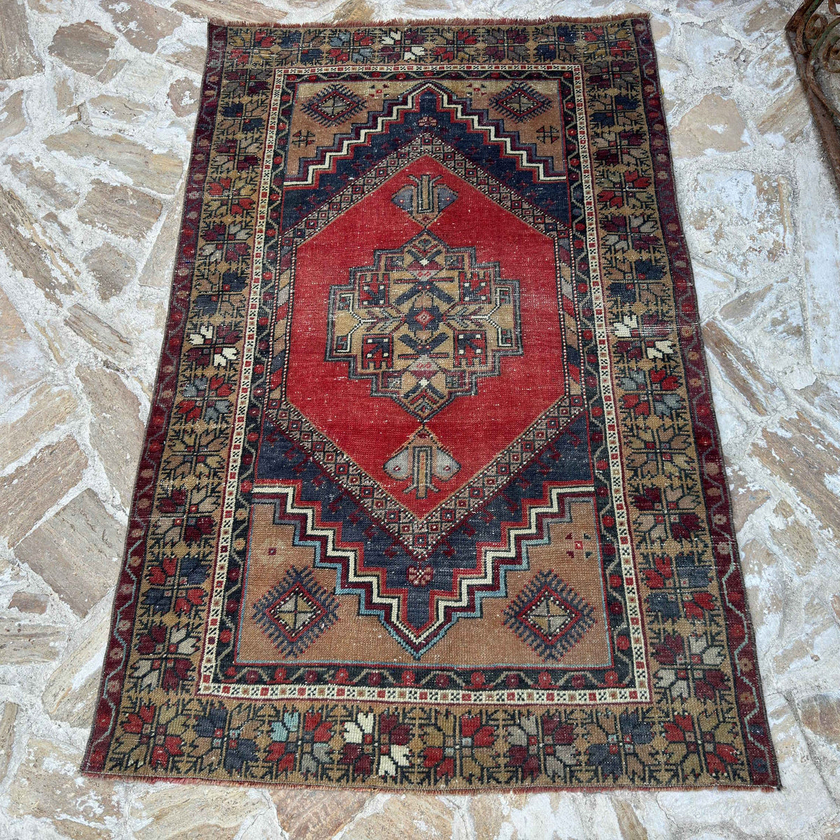 Red 4' x 6' vintage Turkish area rug in wool and cotton, shown on the floor.