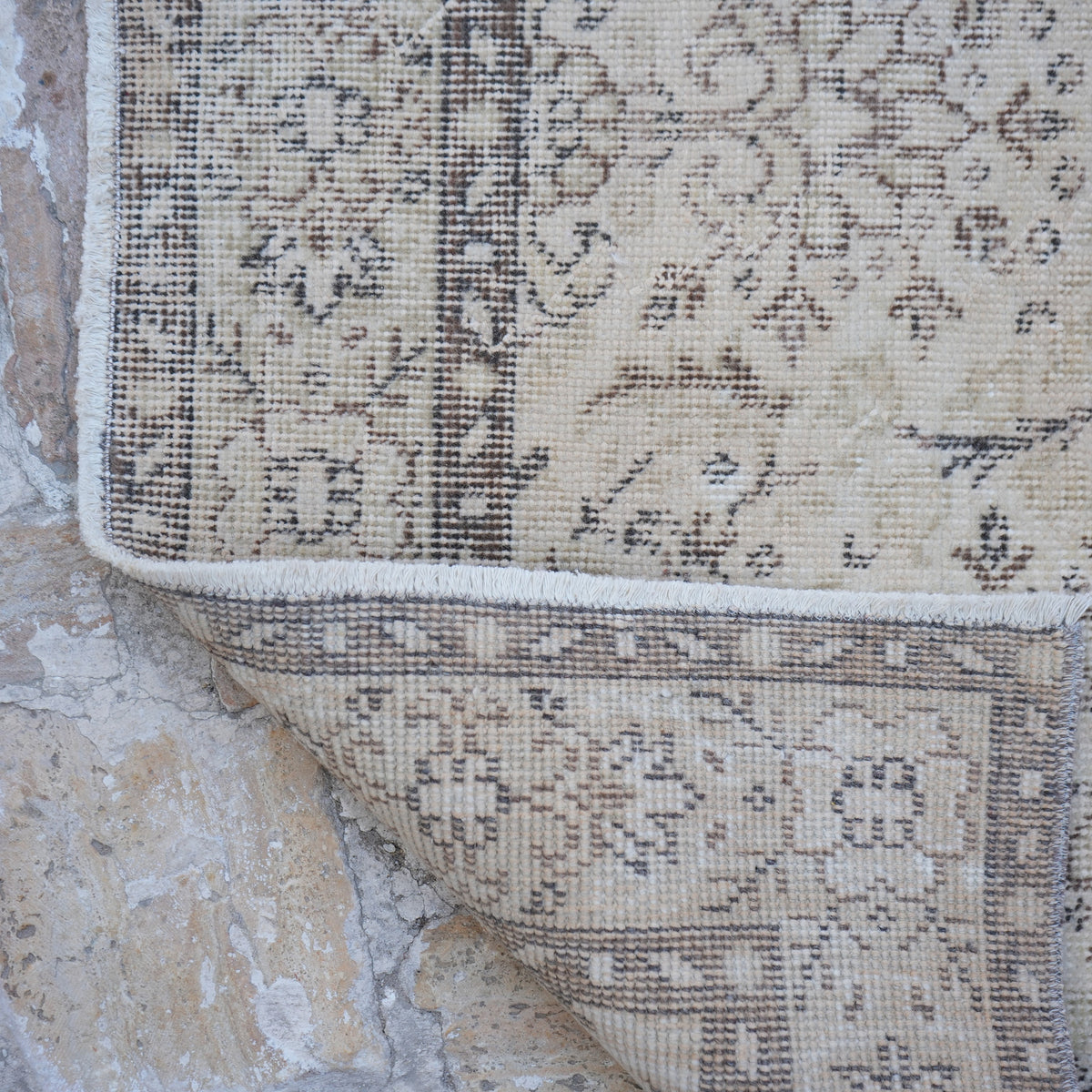 1970s beige vintage Turkish area rug with traditional design, hand-knotted weave and low pile.