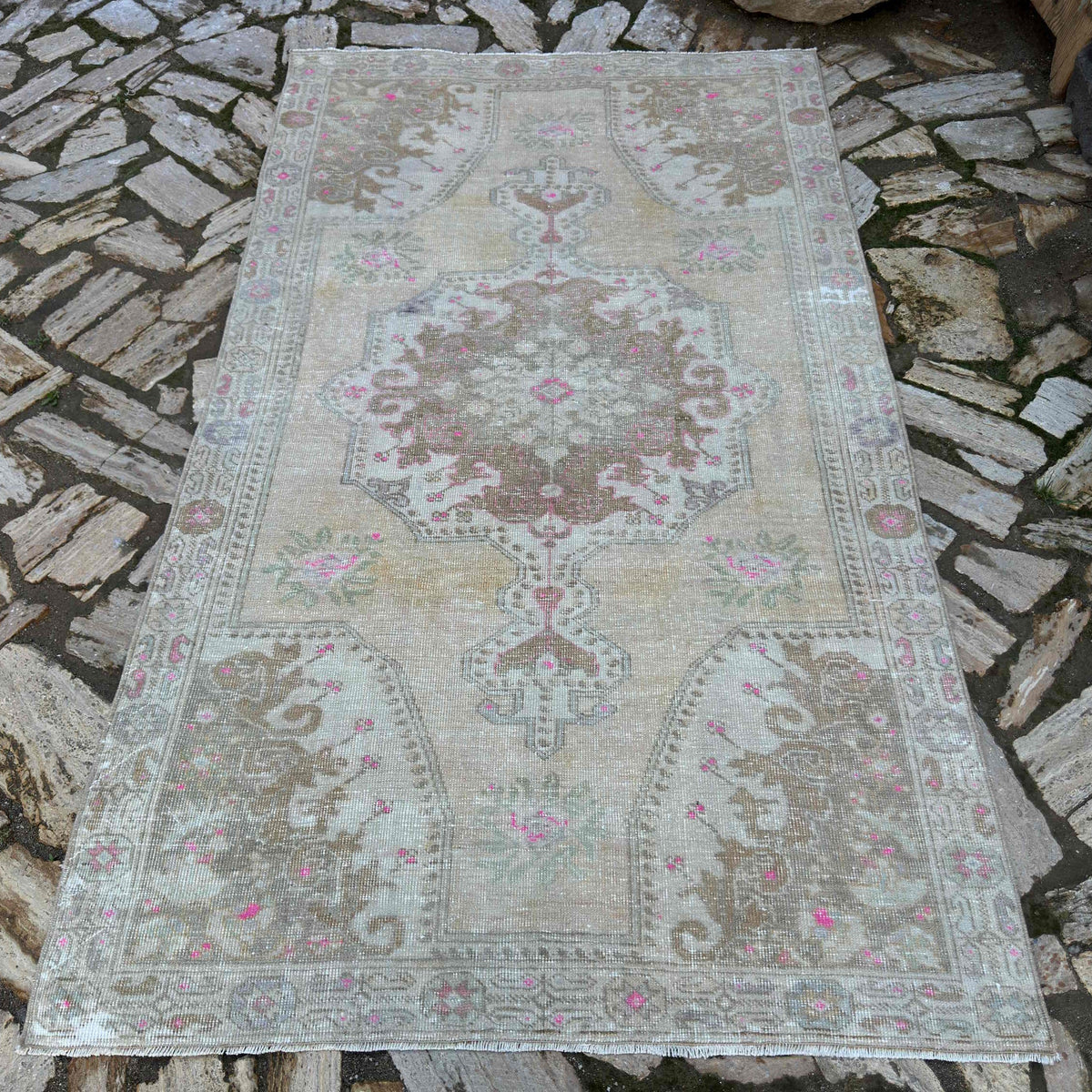 Pale Yellow 4' x 7' vintage Turkish area rug in wool and cotton, shown on the floor.