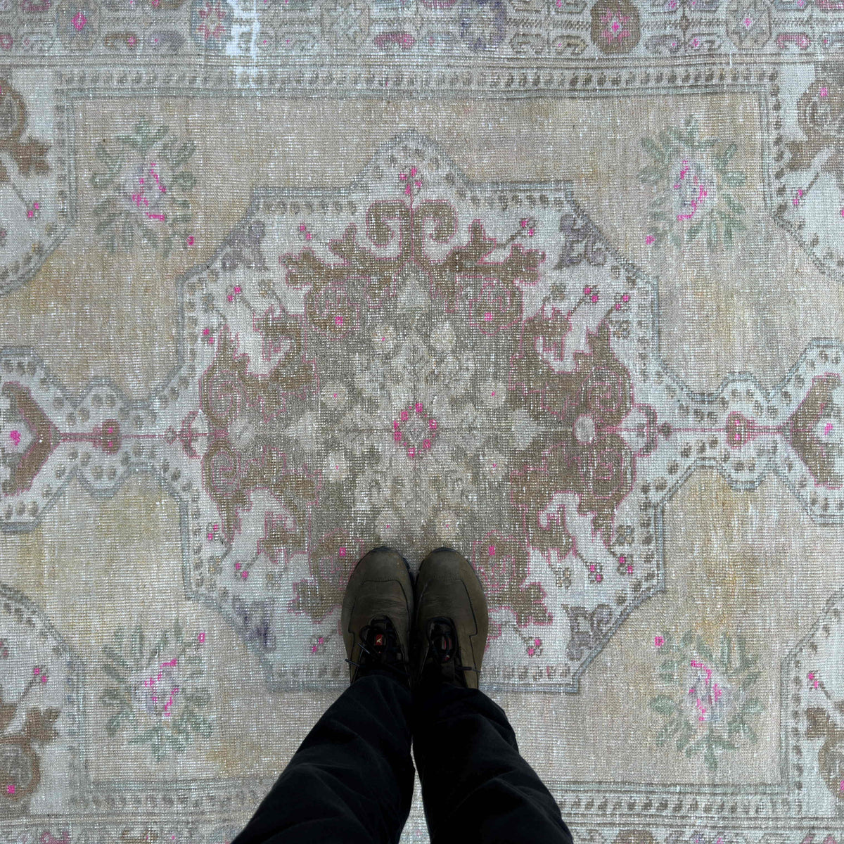 1970s pale yellow vintage Turkish area rug with neutral design, hand-knotted weave and low pile.