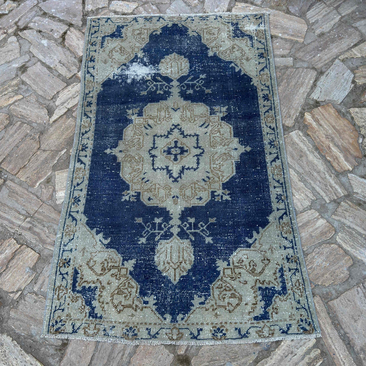 Blue 3' x 5' vintage Turkish distressed rug in wool and cotton, shown on the floor.