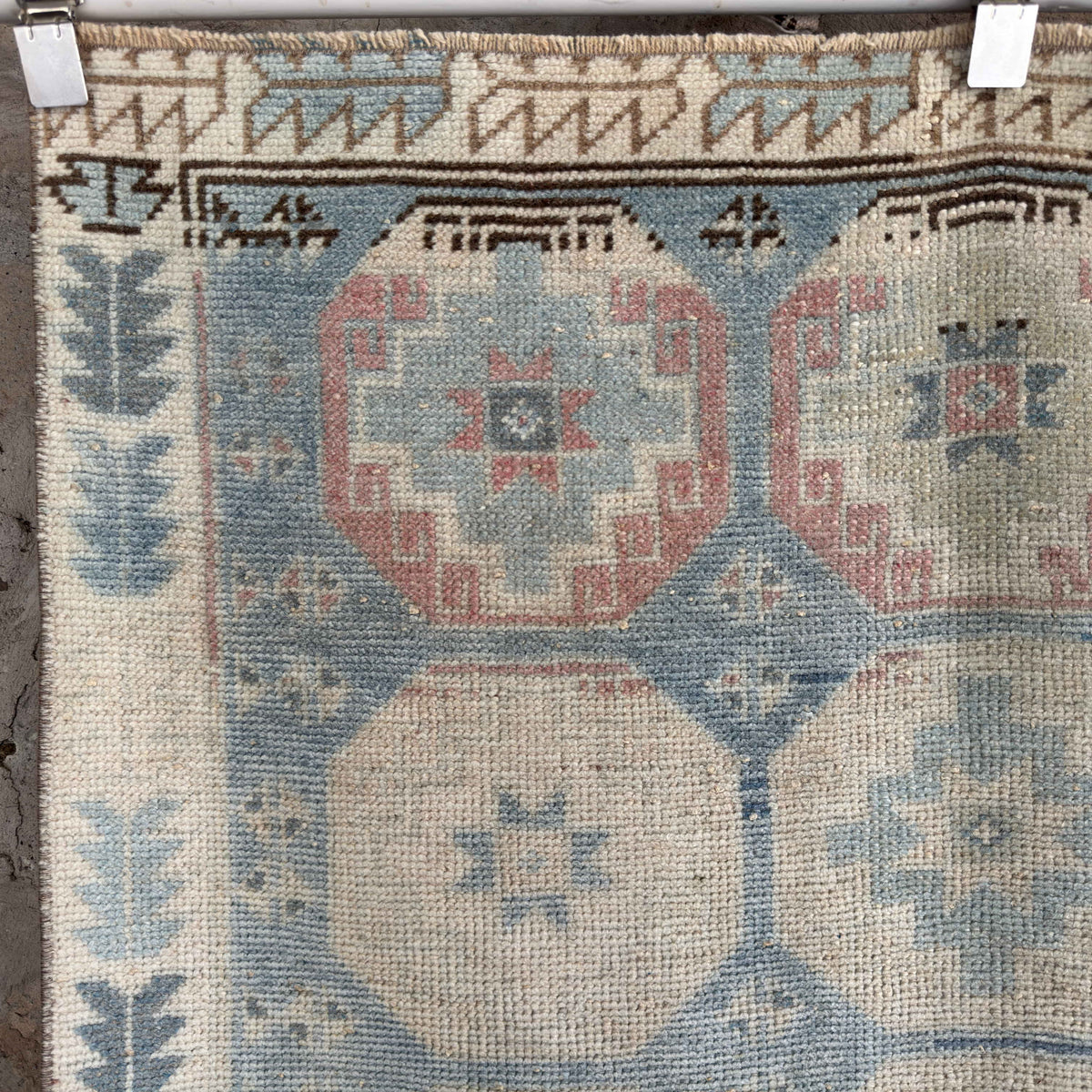 1970s blue vintage Turkish distressed rug with traditional design, hand-knotted weave and low pile.