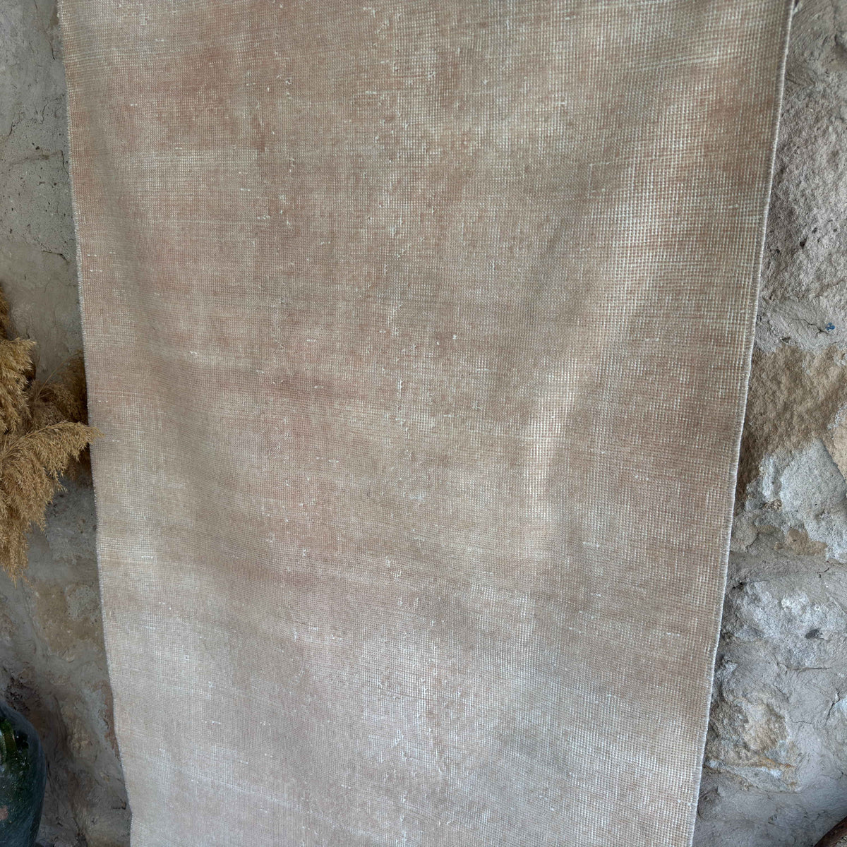 Beige 4' x 6' vintage Turkish distressed rug in wool and cotton, shown on the floor.