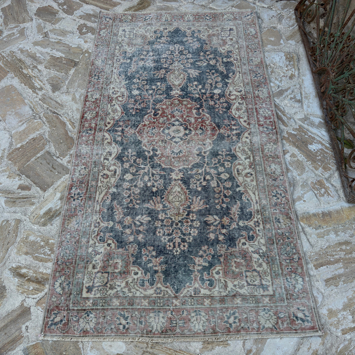Blue 4' x 7' vintage Turkish distressed rug in wool and cotton, shown on the floor.
