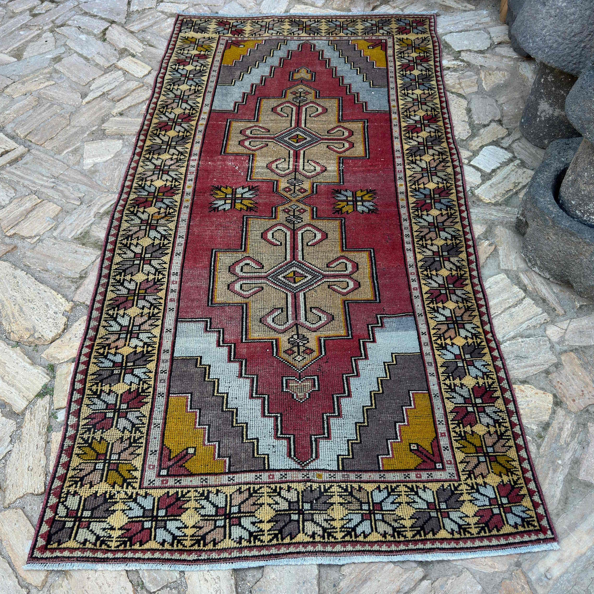 Red 4' x 8' vintage Turkish distressed rug in wool and cotton, shown on the floor.