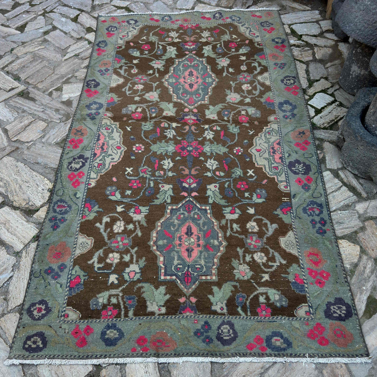 Brown 5' x 8' vintage Turkish distressed rug in wool and cotton, shown on the floor.