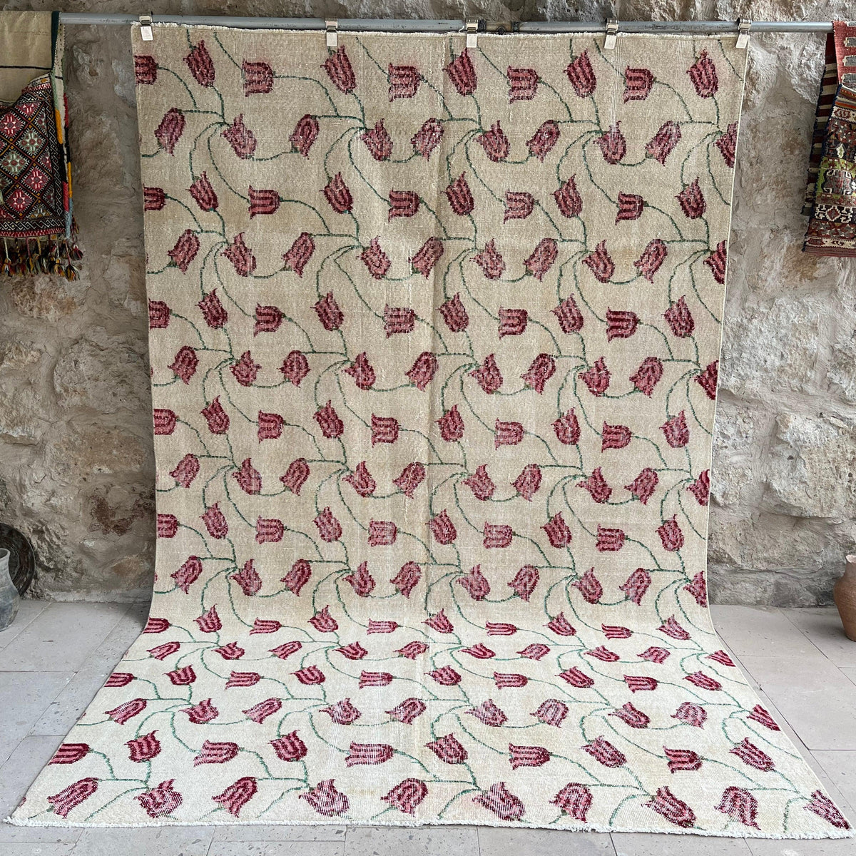 Beige 7' x 10' vintage distressed rug with floral design, handmade in Turkey – Earl.