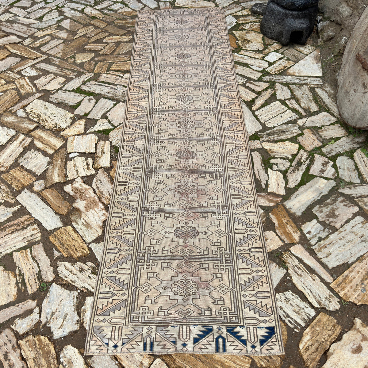 Beige 3' x 10' vintage Turkish distressed runner rug in wool and cotton, shown on the floor.