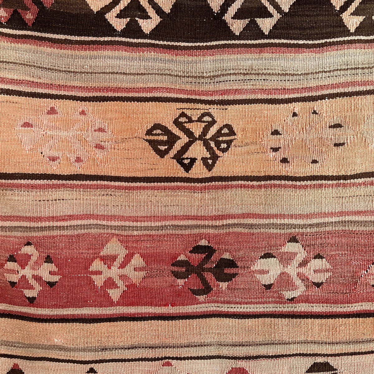 Close-up of the red vintage Turkish flatweave rug showing traditional details, flatweave construction, wool and cotton and low pile.