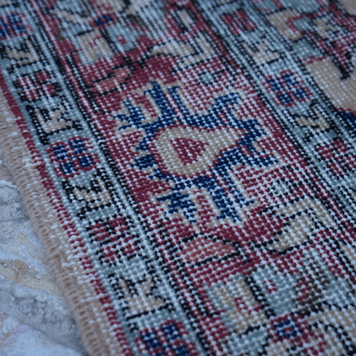 Red 4' x 7' vintage Turkish floral rug in wool and cotton, shown on the floor.