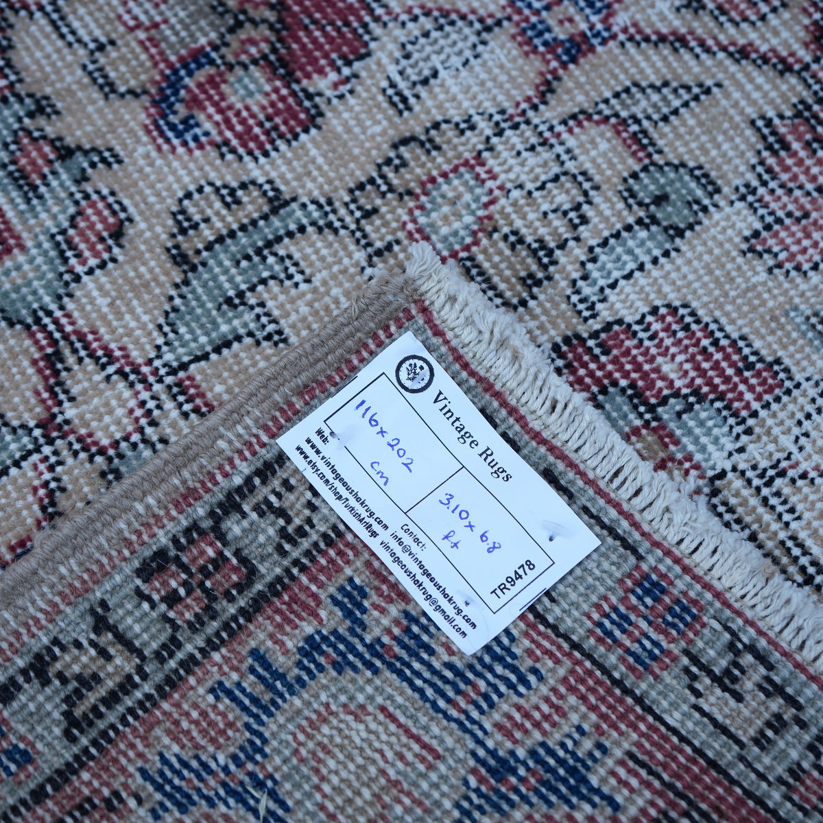 Red 4' x 7' vintage Turkish floral rug from the 1970s with floral design.
