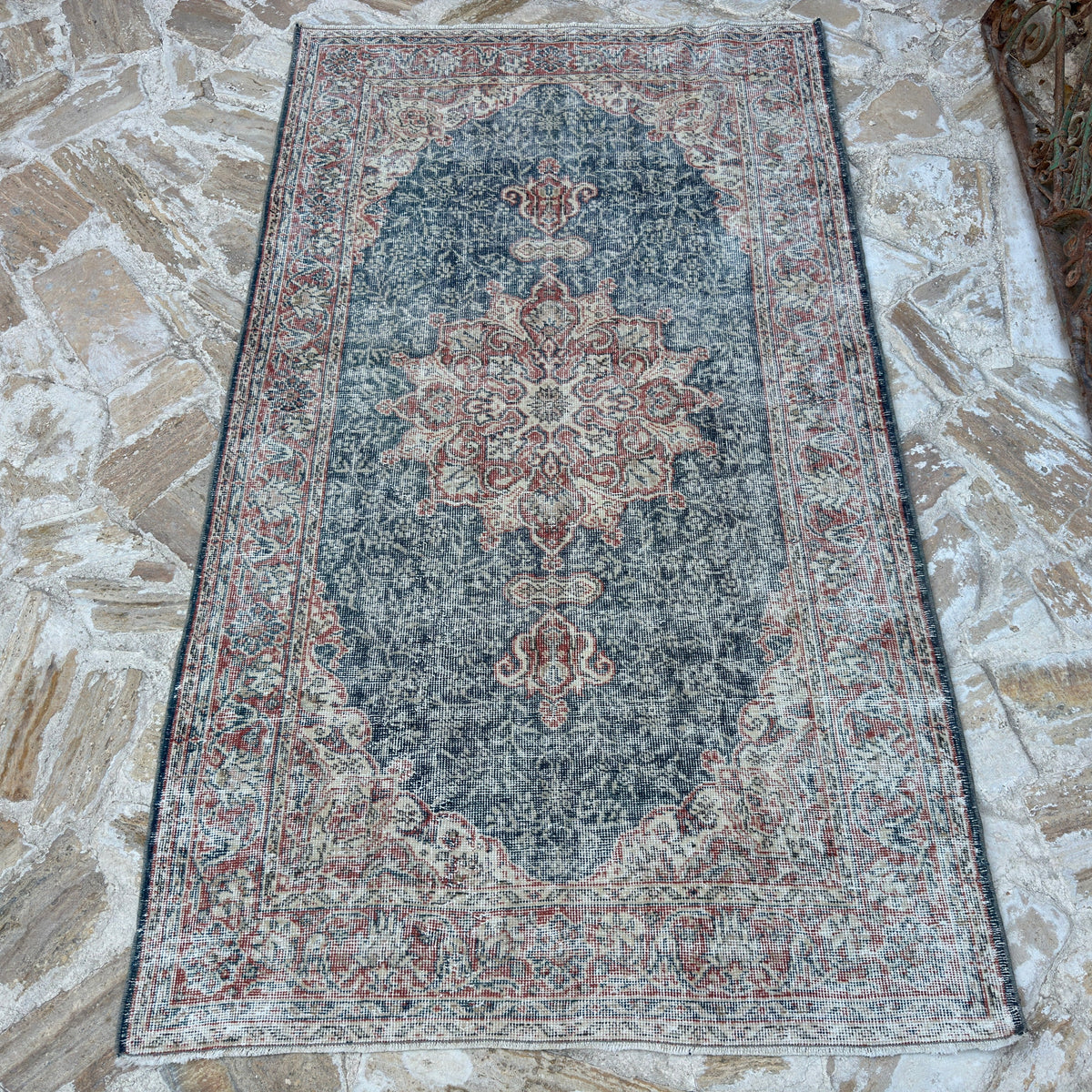 Blue 4' x 7' vintage Turkish geometric rug in wool and cotton, shown on the floor.