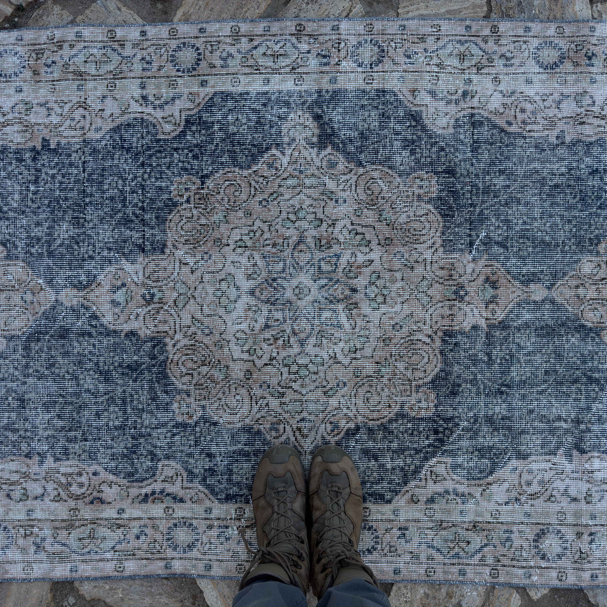 1970s blue vintage Turkish geometric rug with medallion design, hand-knotted weave and low pile.