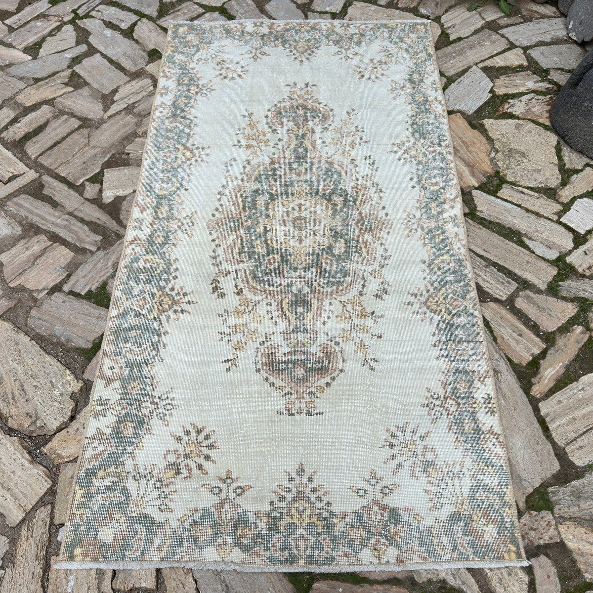 Pale Green 4' x 7' vintage Turkish geometric rug in wool and cotton, shown on the floor.