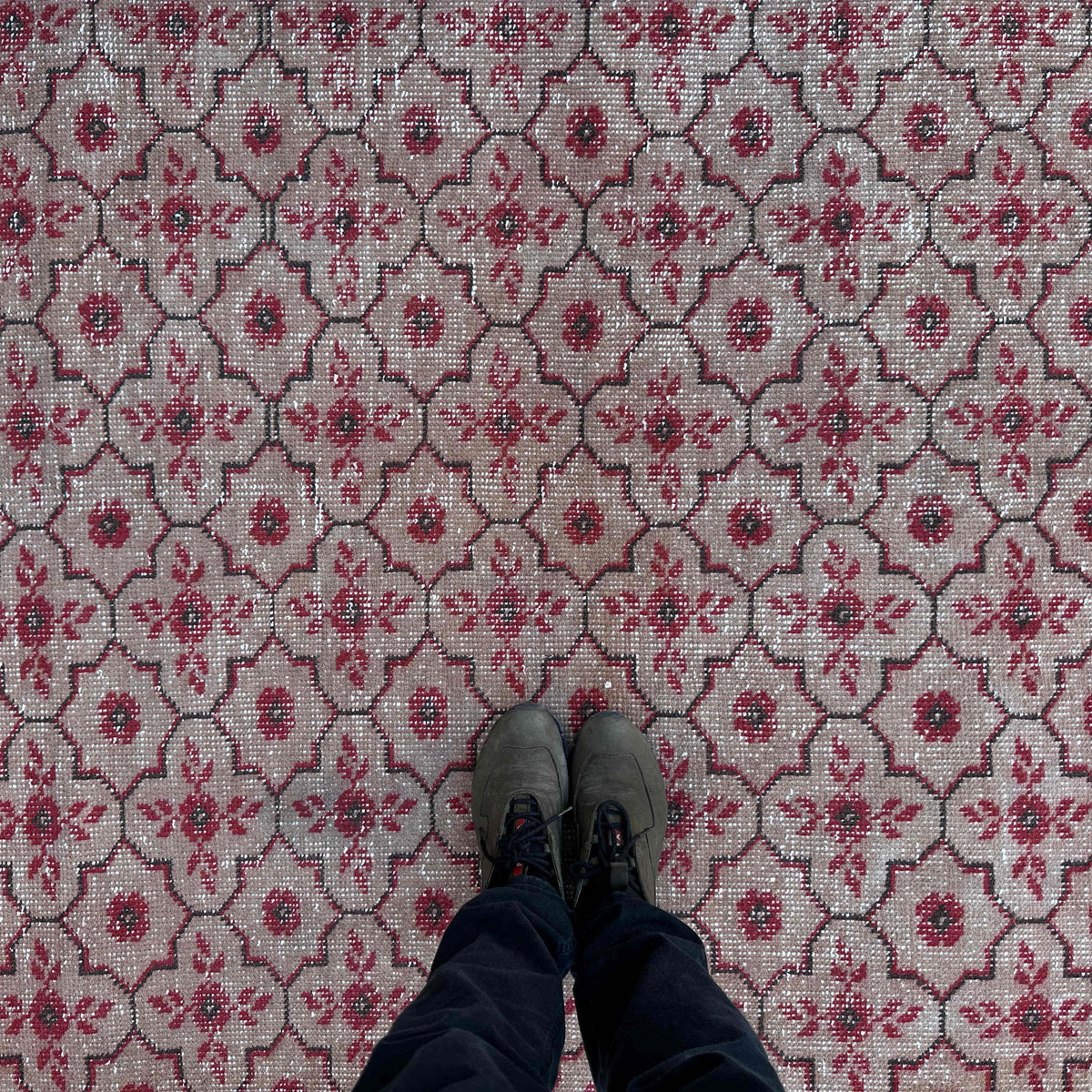 1970s red vintage Turkish geometric rug with geometric design, hand-knotted weave and low pile.