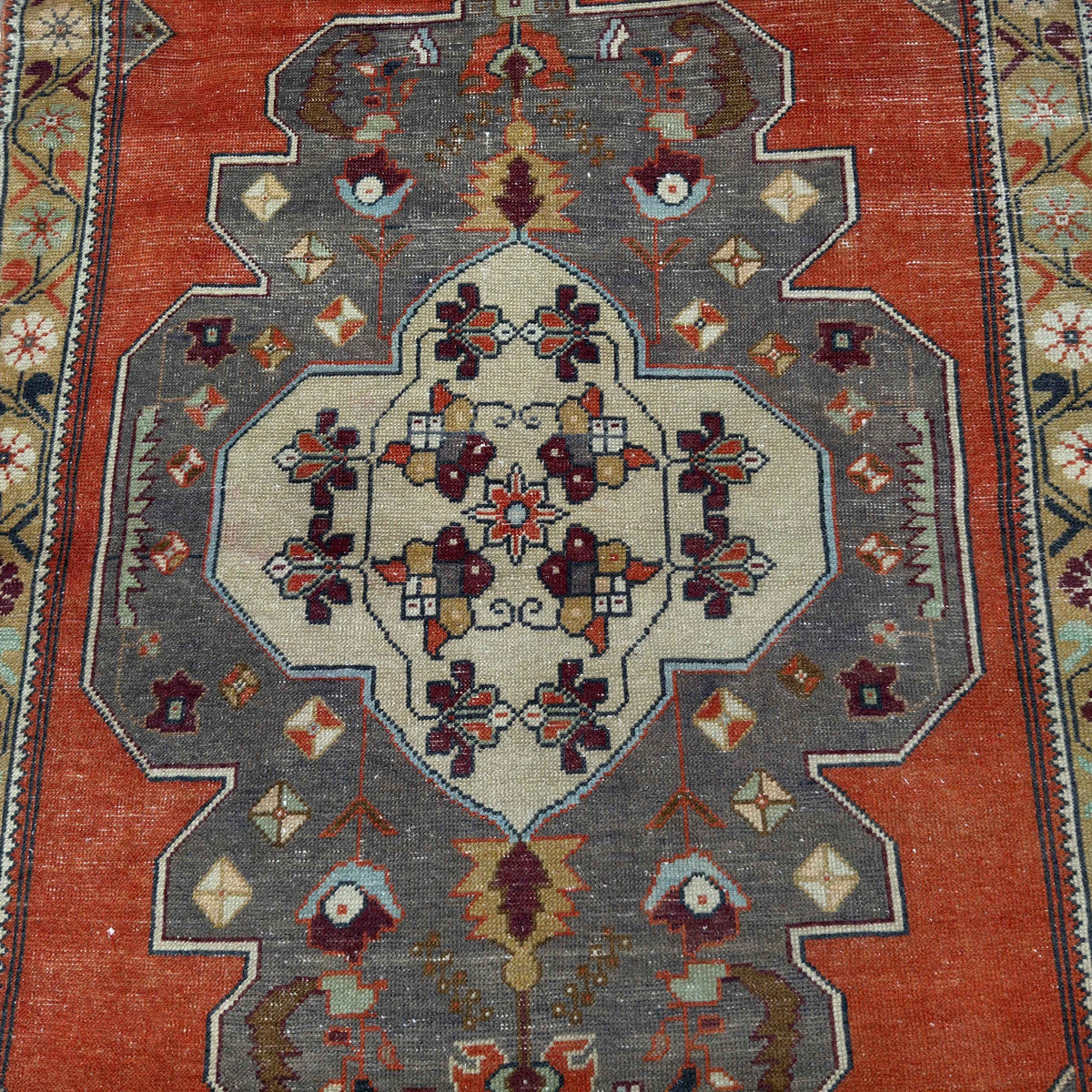 1970s orange vintage Turkish geometric rug with traditional design, hand-knotted weave and low pile.