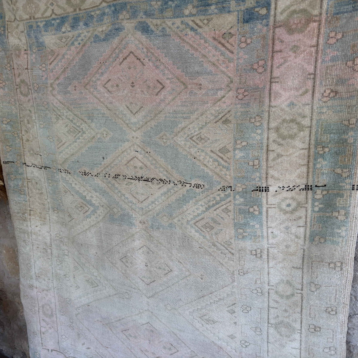 1970s pale blue vintage Turkish geometric rug with neutral design, hand-knotted weave and low pile.