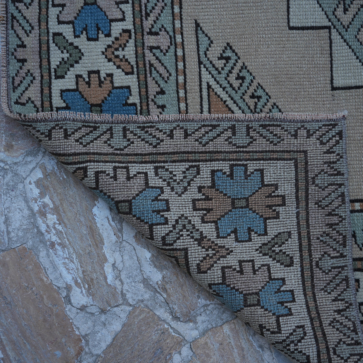 1970s beige vintage Turkish geometric rug with geometric design, hand-knotted weave and low pile.
