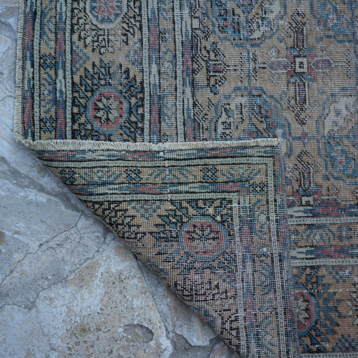 1970s pale orange vintage Turkish geometric rug with geometric design, hand-knotted weave and low pile.