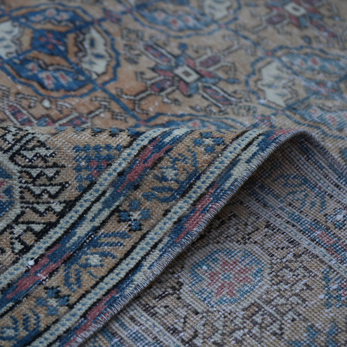 Additional view of the pale orange vintage Turkish geometric rug, hand-knotted in wool and cotton.