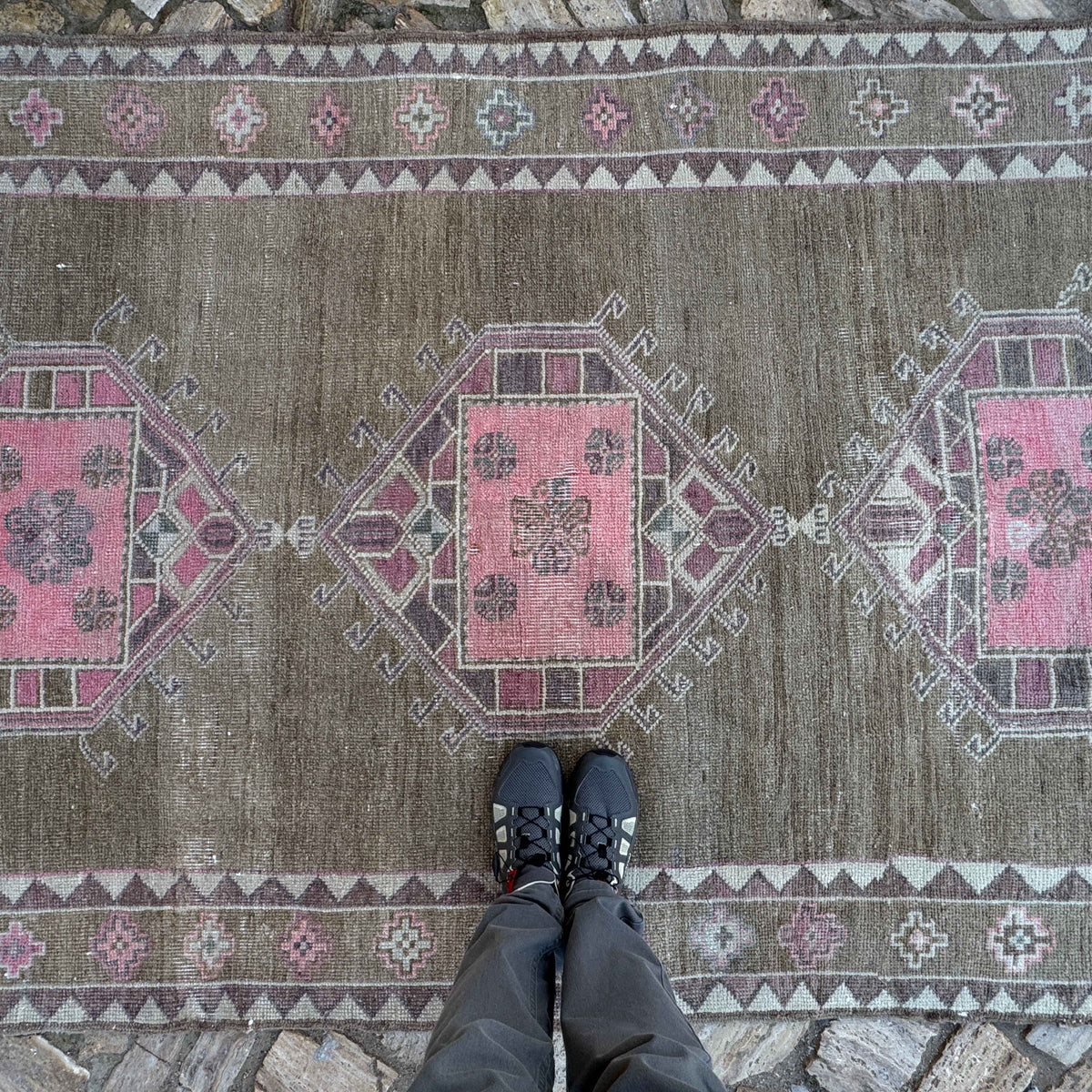 1970s pale pink vintage Turkish kars area rug with traditional design, hand-knotted weave and low pile.