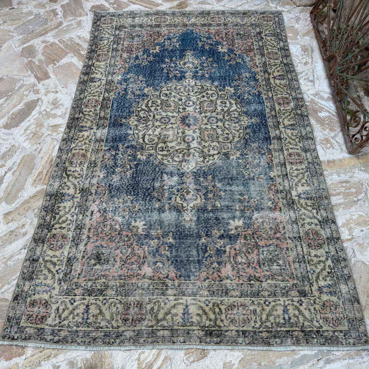 Blue 5' x 8' vintage Turkish kayseri rug in wool and cotton, shown on the floor.
