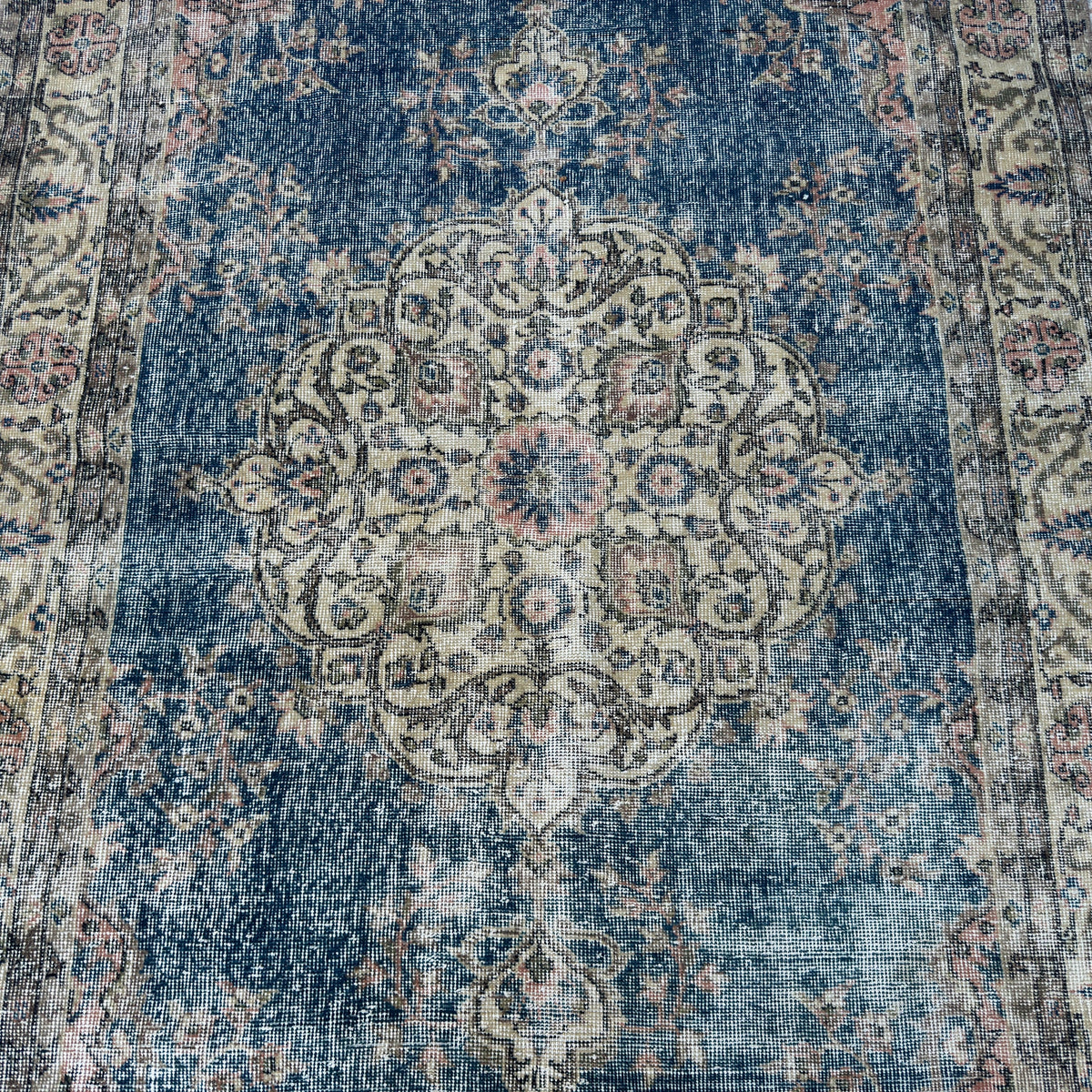 1970s blue vintage Turkish kayseri rug with traditional design, hand-knotted weave and low pile.