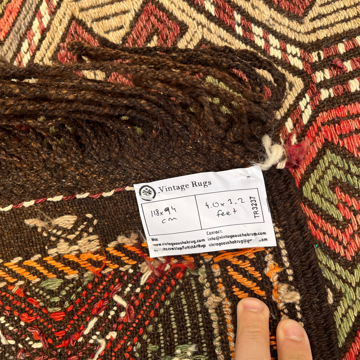 1970s brown vintage Turkish kilim rug with traditional design, flatweave construction and low pile.