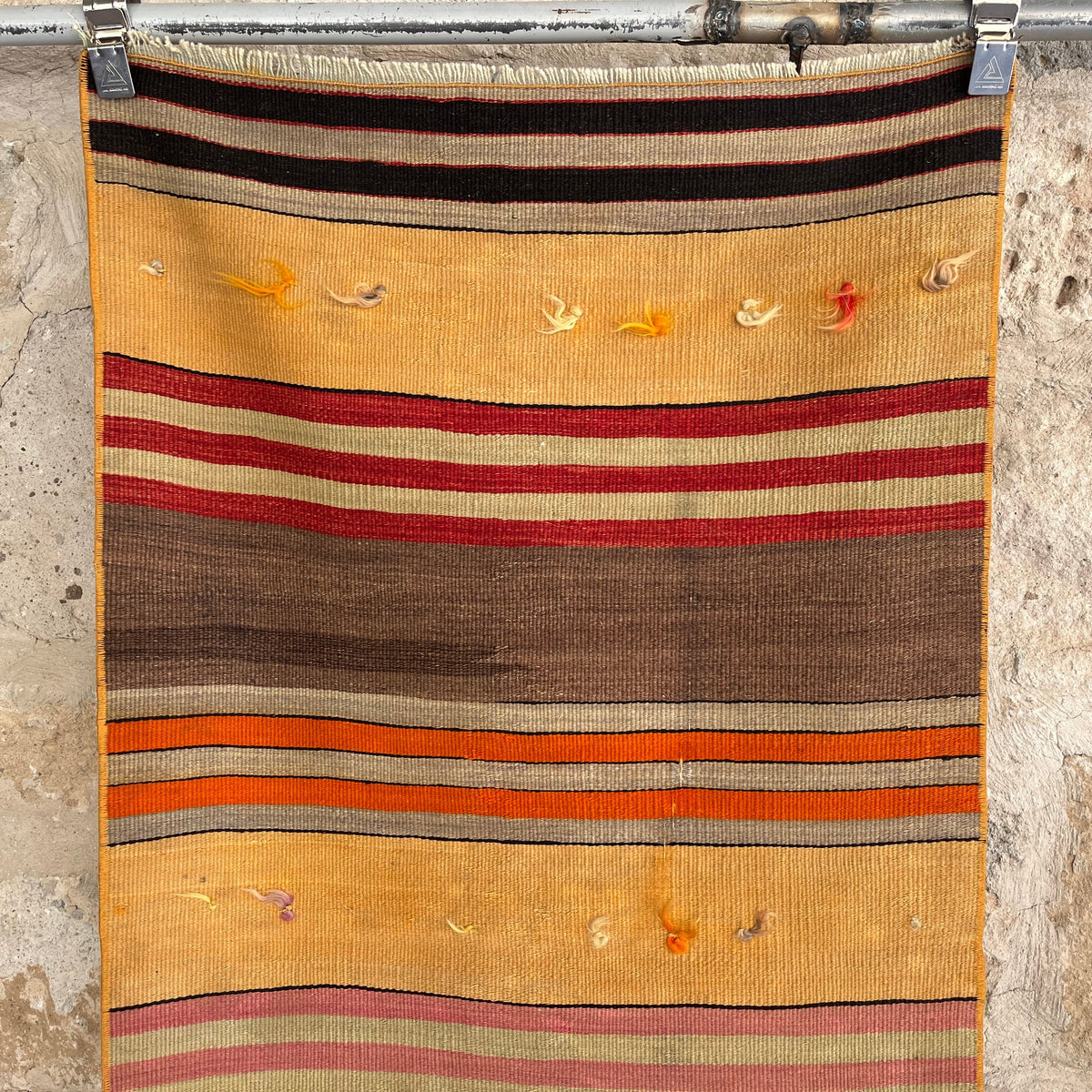 1970s yellow vintage Turkish kilim rug with striped design, flatweave construction and low pile.