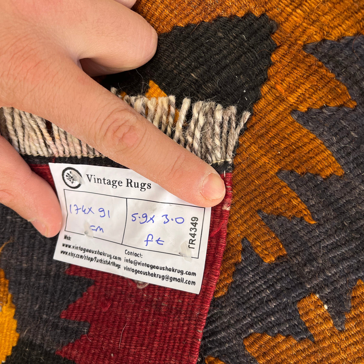 1970s red vintage Turkish kilim rug with traditional design, flatweave construction and low pile.