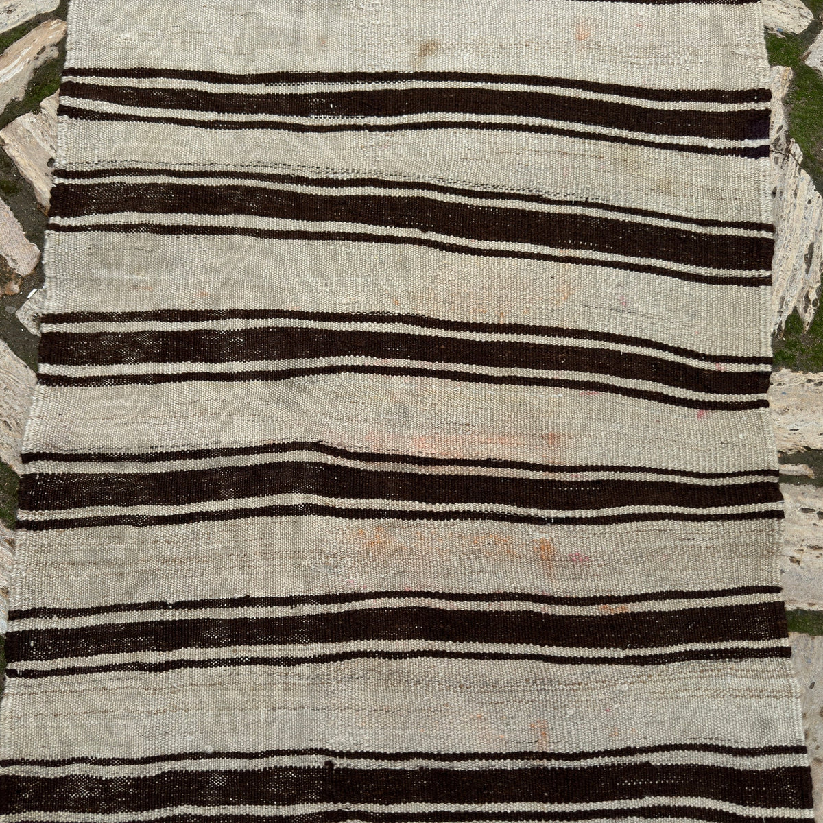 1970s black vintage Turkish kilim rug with striped design, flatweave construction and low pile.