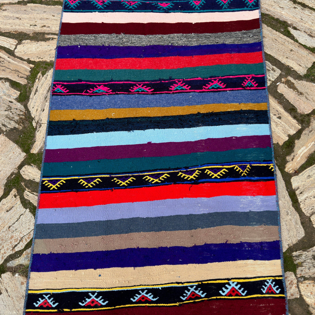 1970s pink vintage Turkish kilim runner rug with striped design, flatweave construction and low pile.