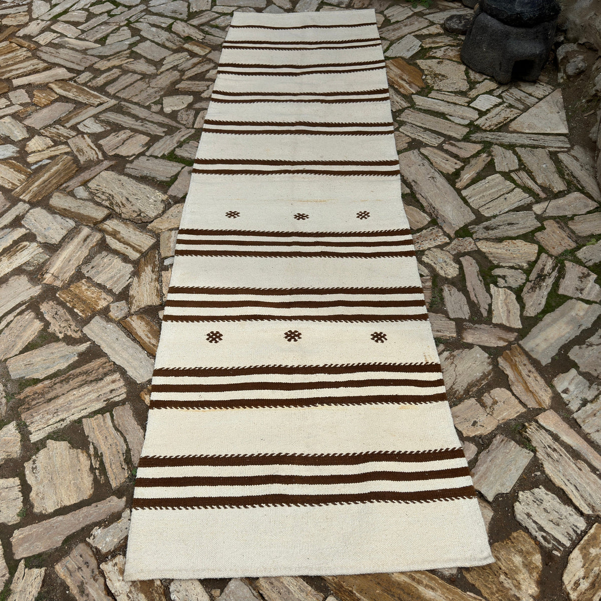 Beige 3' x 11' vintage Turkish kilim runner rug in wool and cotton, shown on the floor.