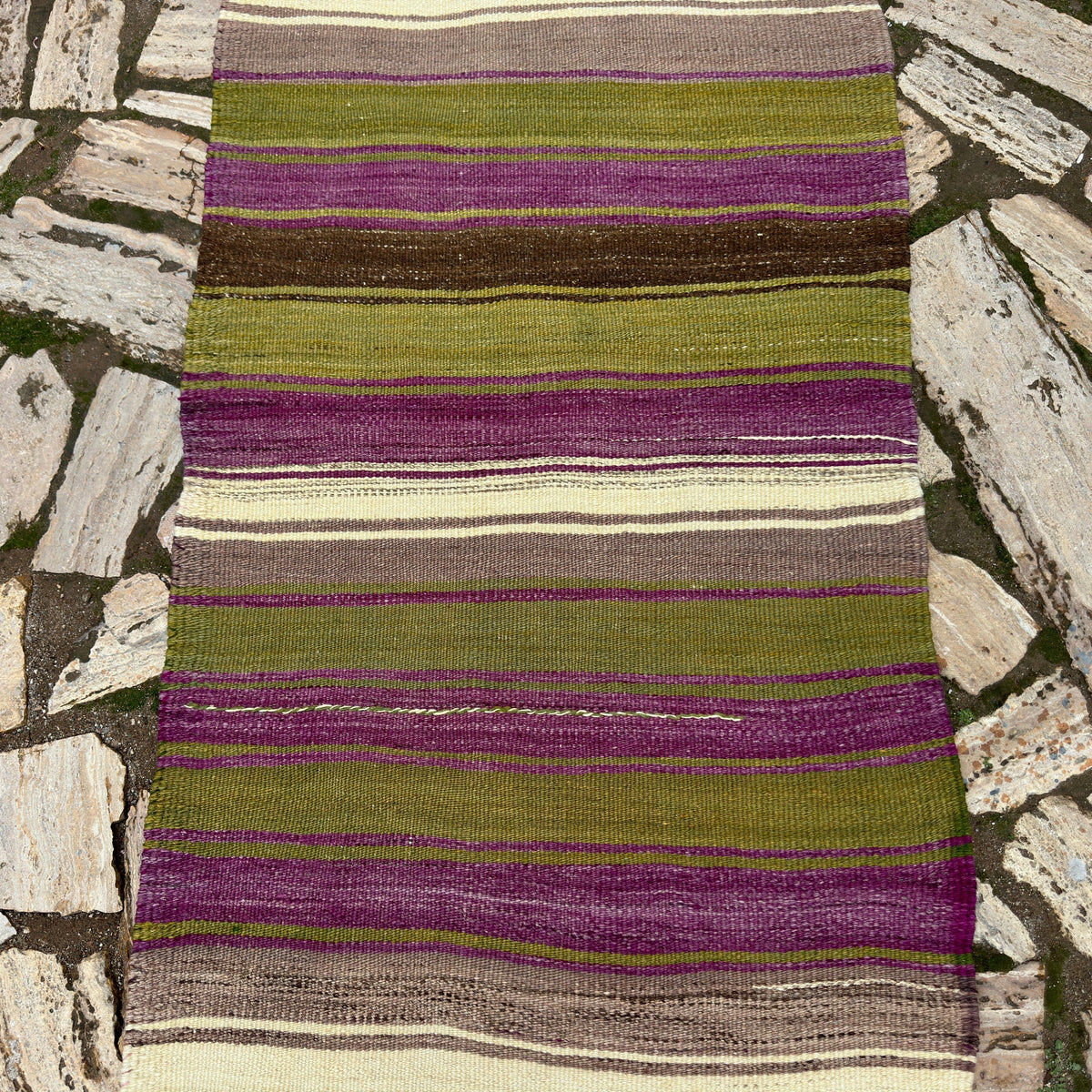 1970s green vintage Turkish kilim runner rug with striped design, flatweave construction and low pile.