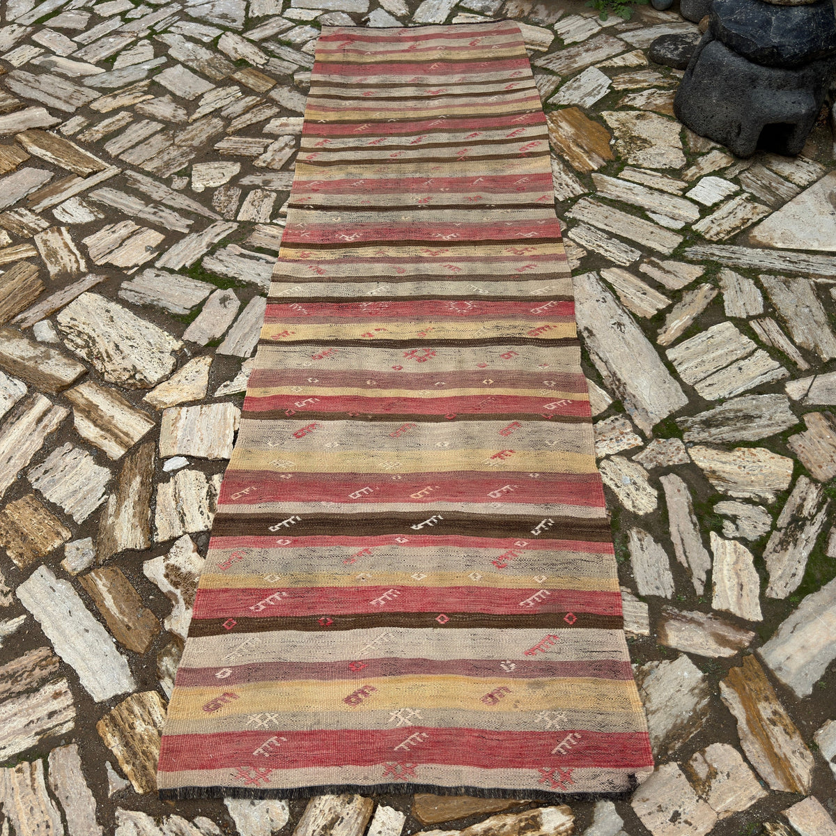 Red 3' x 9' vintage Turkish kilim runner rug in wool and cotton, shown on the floor.