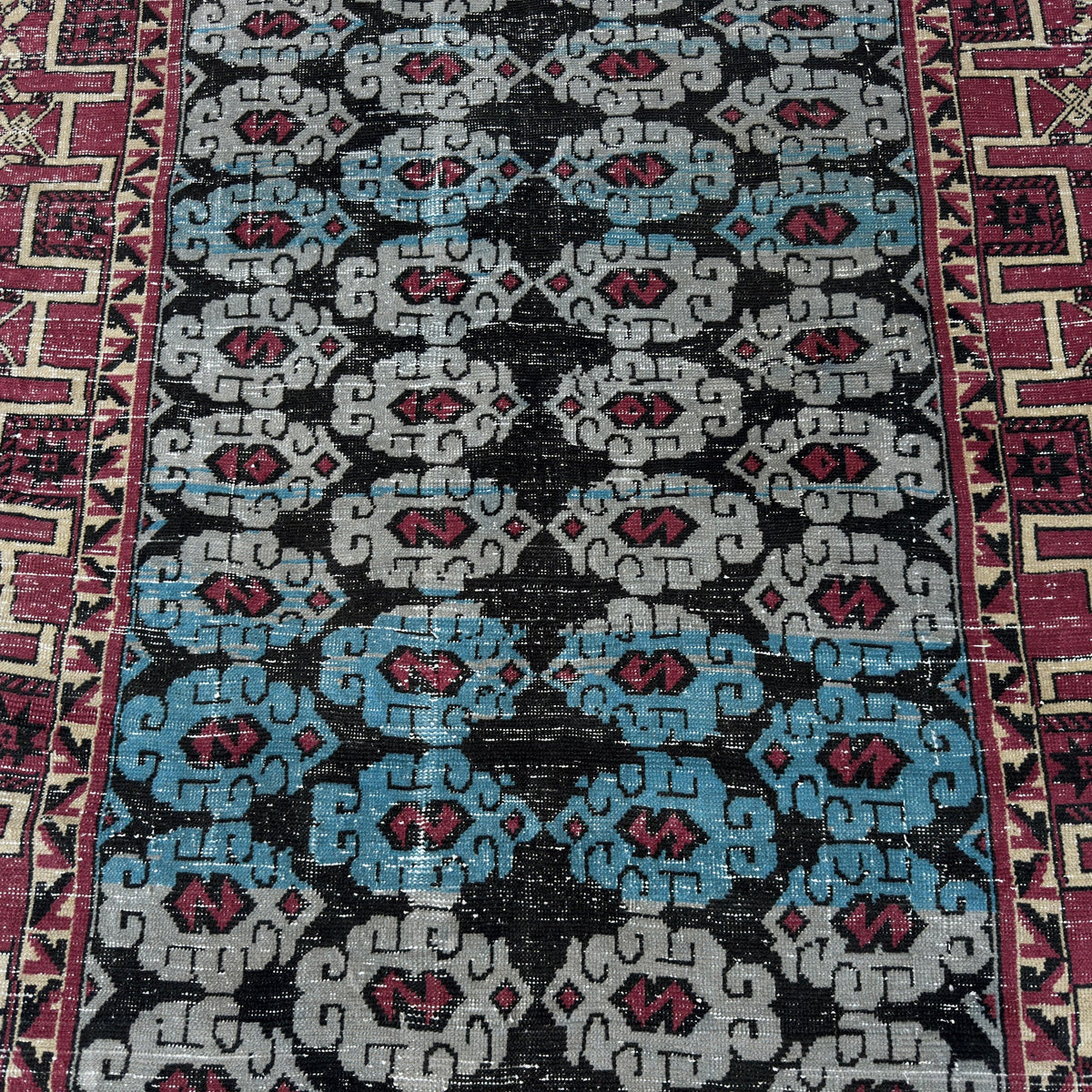 1970s blue vintage Turkish konya rug with geometric design, hand-knotted weave and low pile.