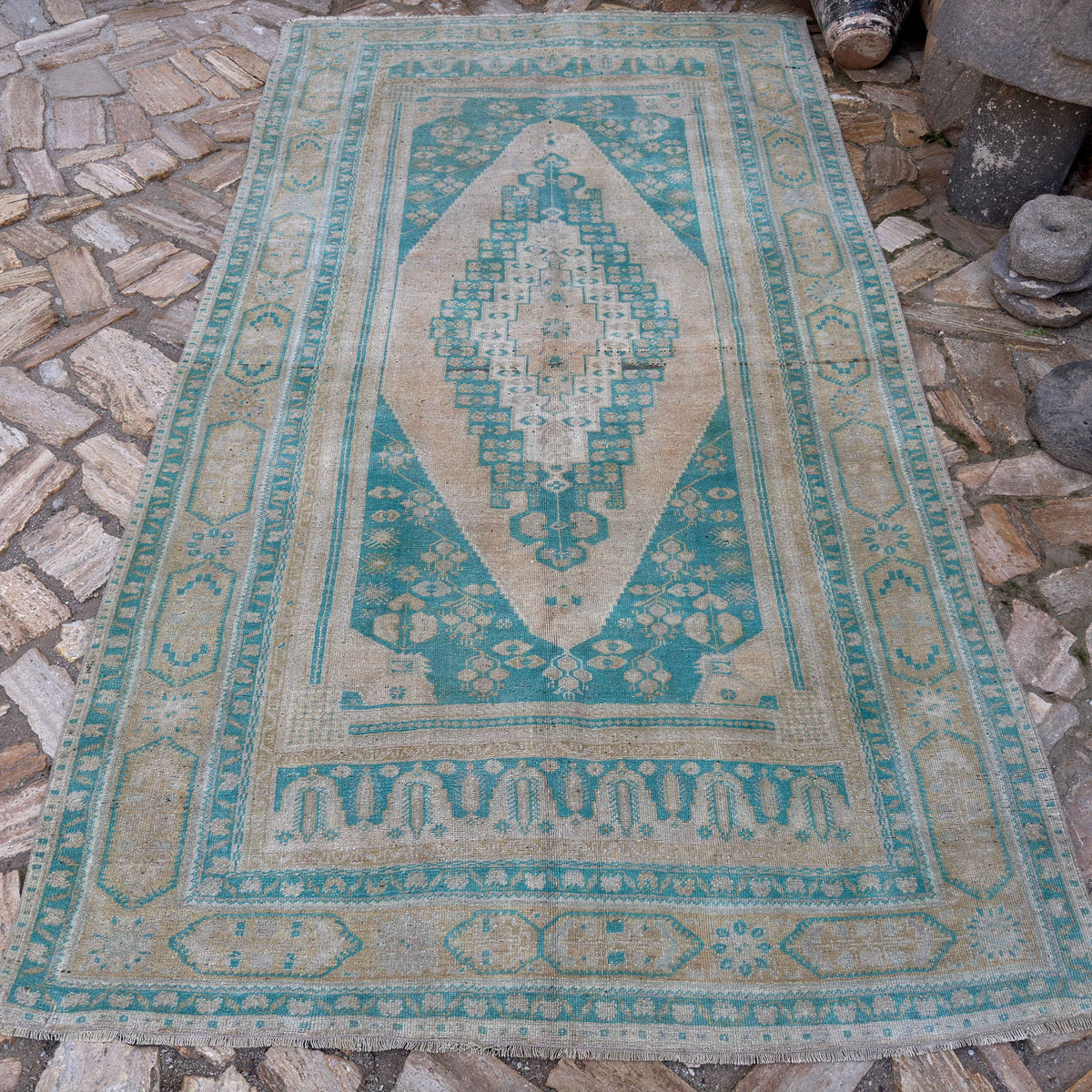 Pale Green 5' x 10' vintage Turkish large rug in wool and cotton, shown on the floor.
