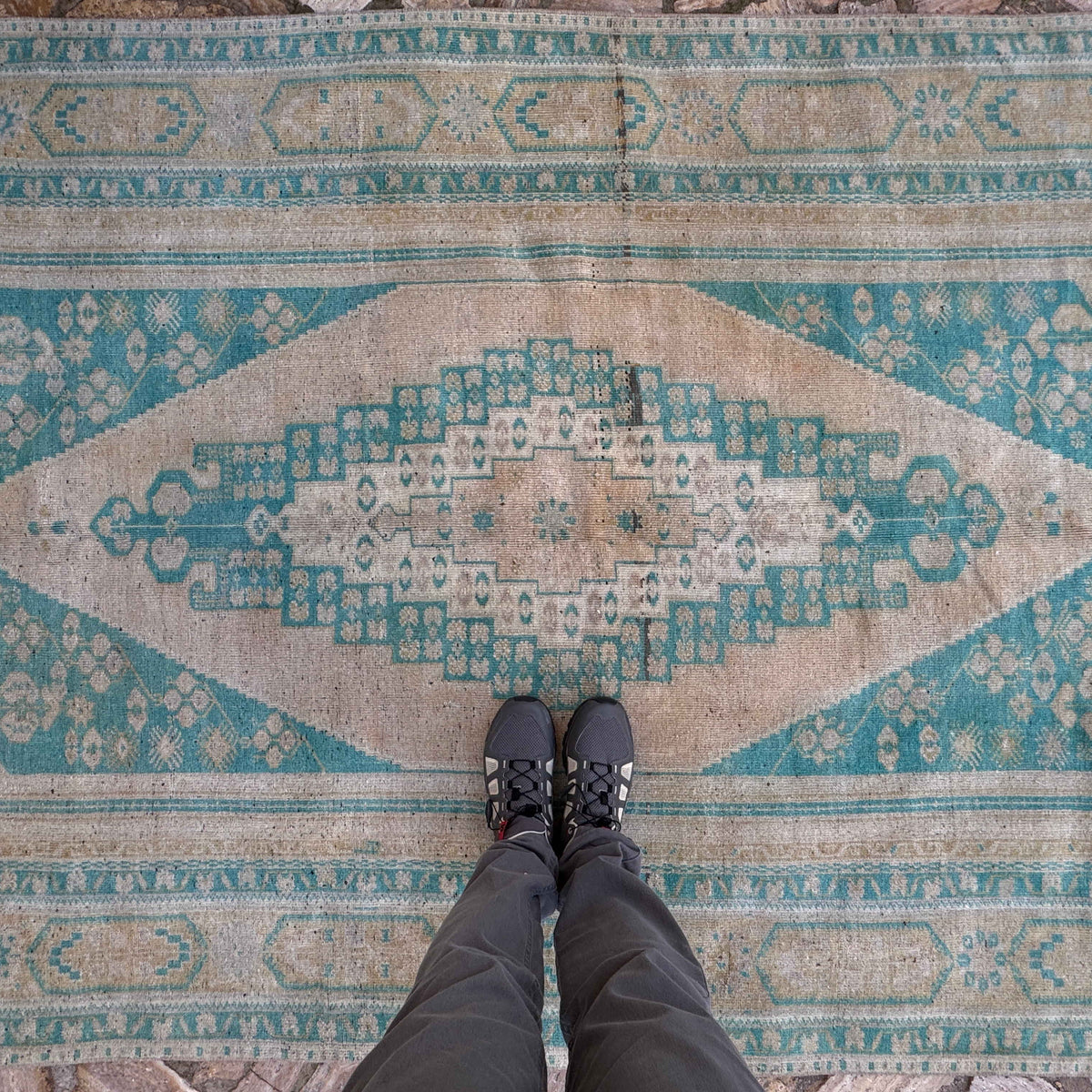1970s pale green vintage Turkish large rug with traditional design, hand-knotted weave and low pile.