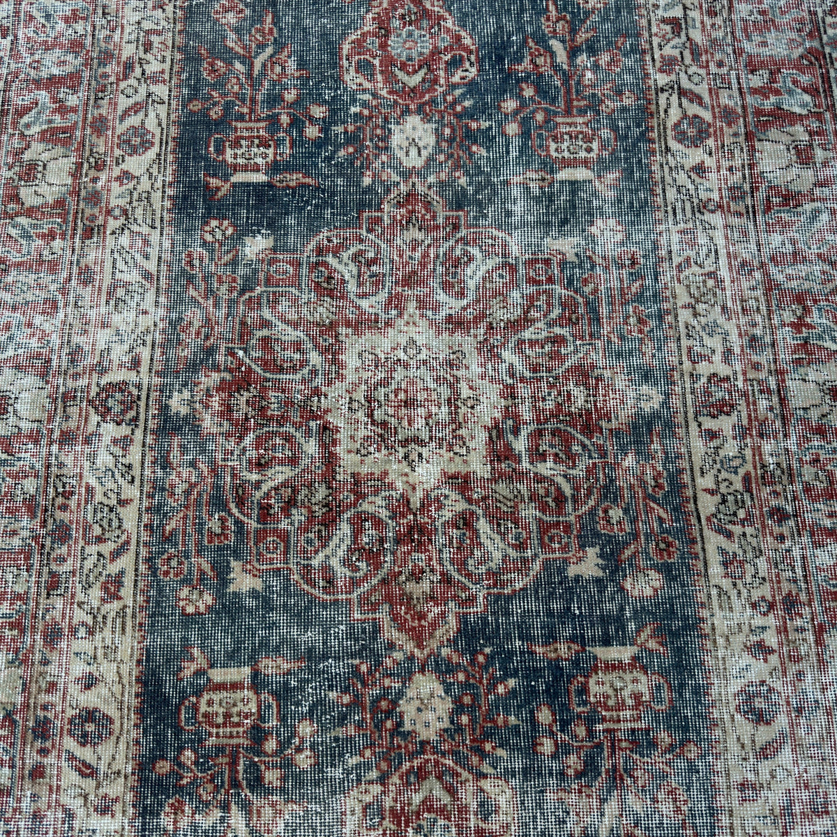 1970s blue vintage Turkish medallion rug with traditional design, hand-knotted weave and low pile.