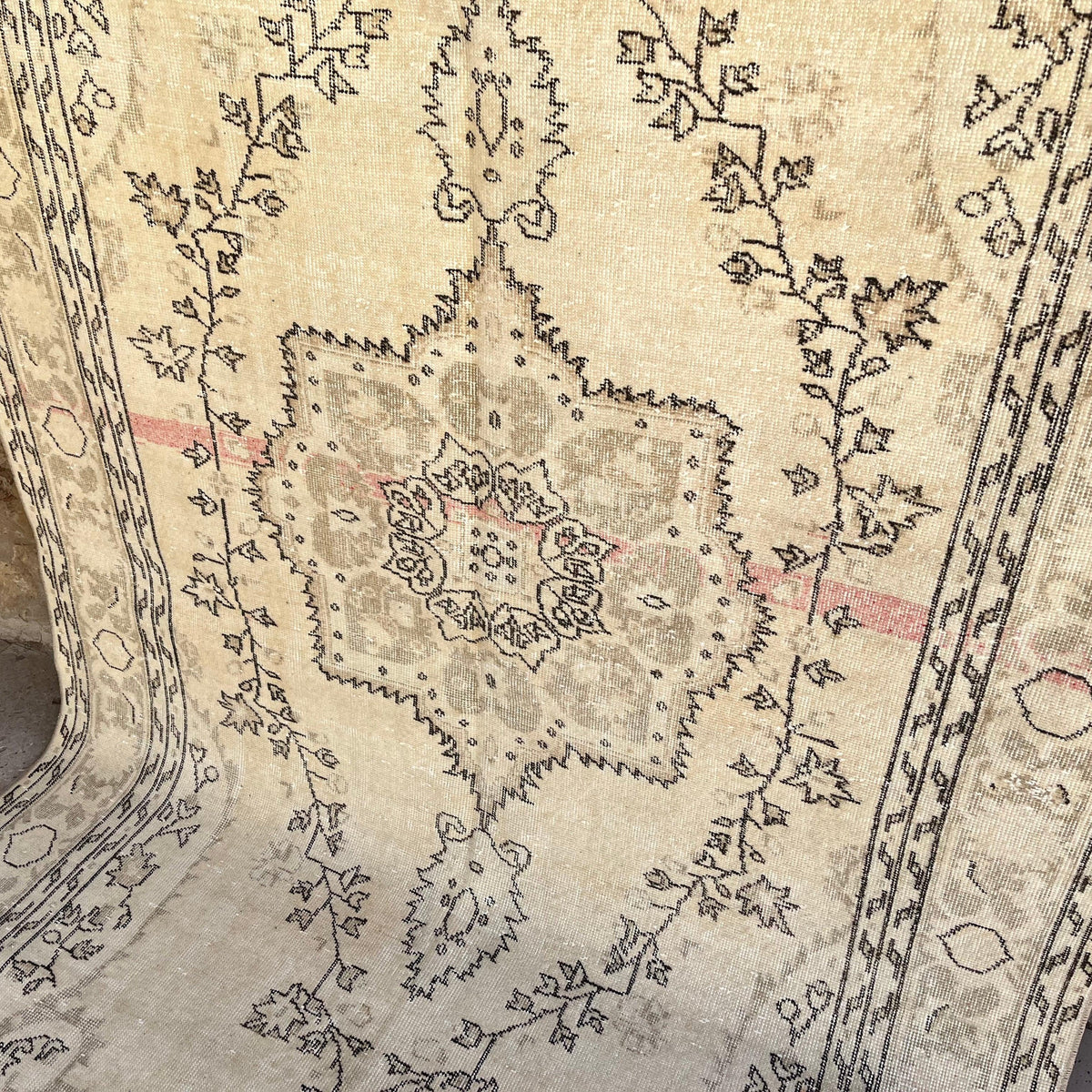 Beige 5' x 10' vintage Turkish medallion rug in wool and cotton, shown on the floor.