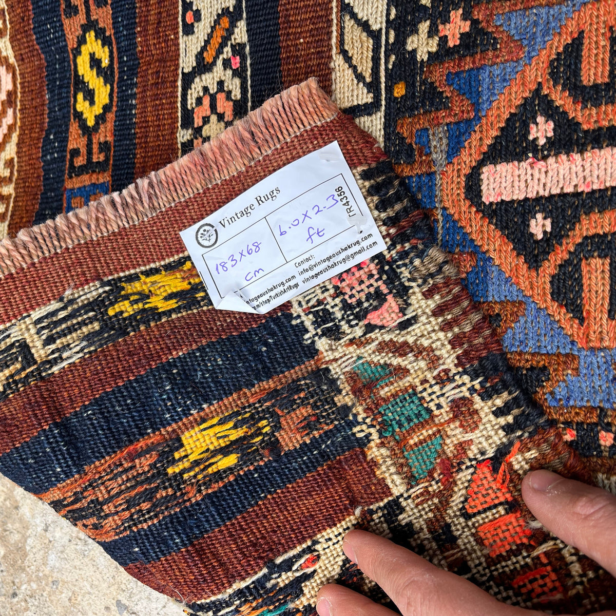 1970s brown vintage mini kilim runner rug with traditional design, flatweave construction and low pile.