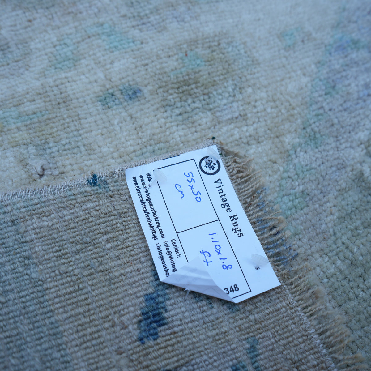 Beige 2' x 2' vintage Turkish mini rug from the 1970s with traditional design.